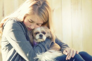children grieving over loss of pet illustrated by girl with dog